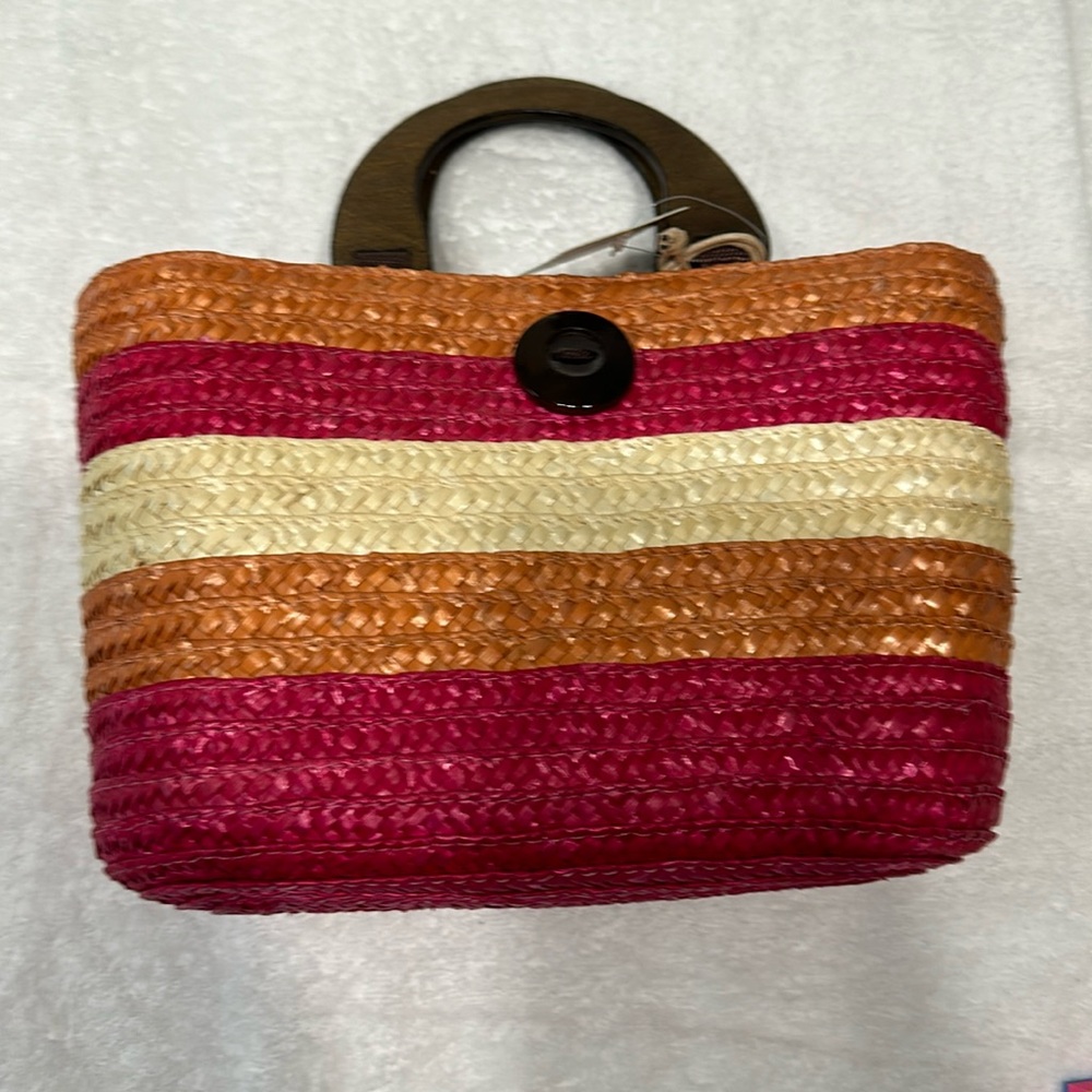 Handbag,Caribbean JOE,is small in size and comes in pink,orange and beige